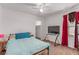 Cozy bedroom with natural light, a ceiling fan, a TV, and closet access at 3821 E Summit Ave, Pahrump, NV 89061