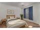 Serene bedroom with natural light, wooden headboard, and calming decor at 3821 E Summit Ave, Pahrump, NV 89061