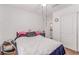 This bedroom has a ceiling fan, a closet, and neutral-toned walls and carpeting at 3821 E Summit Ave, Pahrump, NV 89061