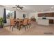 Open dining area featuring modern table, chairs and natural light from nearby window at 3821 E Summit Ave, Pahrump, NV 89061