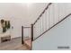 Bright entryway featuring wood floors, stairs with white railings, and decorative wall accents at 3821 E Summit Ave, Pahrump, NV 89061