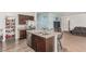 Spacious kitchen island with bar seating and stainless steel appliances at 3821 E Summit Ave, Pahrump, NV 89061
