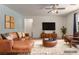 Spacious living area with leather seating, media center, and stylish decor at 3821 E Summit Ave, Pahrump, NV 89061