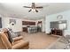 Open-concept living room seamlessly connects to the kitchen with a breakfast bar and stainless steel appliances at 3821 E Summit Ave, Pahrump, NV 89061