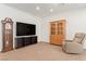 Neutral living room featuring a wood china cabinet, recliner chair, and grandfather clock at 3821 E Summit Ave, Pahrump, NV 89061