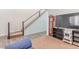 Staircase in the living room with wood floors and a wall mounted television at 3821 E Summit Ave, Pahrump, NV 89061