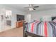 Bedroom featuring a spacious layout and large TV, leading into the ensuite bathroom at 3821 E Summit Ave, Pahrump, NV 89061