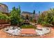Backyard pond with waterfall and landscaping, offering a serene escape at 3821 E Summit Ave, Pahrump, NV 89061