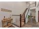 Inviting staircase with wood and white banisters, leading to the upper level of the home at 3821 E Summit Ave, Pahrump, NV 89061