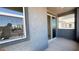 Balcony featuring gray facade with view of next-door building through window at 4705 Parkarbor Ave, Las Vegas, NV 89141