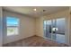 Cozy bedroom with natural light, carpet floors, and sliding door to backyard at 4705 Parkarbor Ave, Las Vegas, NV 89141