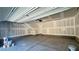 Empty garage with concrete flooring, sheetrocked walls, and garage door opener at 4705 Parkarbor Ave, Las Vegas, NV 89141