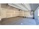 Empty garage with concrete flooring, sheetrocked walls, and garage door opener at 4705 Parkarbor Ave, Las Vegas, NV 89141