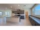 Modern kitchen featuring granite countertops, island, and ample cabinet space at 4705 Parkarbor Ave, Las Vegas, NV 89141