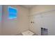 Laundry room features a window, tile flooring, and hookups for washer and dryer at 4705 Parkarbor Ave, Las Vegas, NV 89141