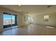 Living room featuring sliding door to balcony and multiple windows at 4705 Parkarbor Ave, Las Vegas, NV 89141