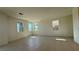 Large, bright living room with multiple windows and tiled flooring at 4705 Parkarbor Ave, Las Vegas, NV 89141