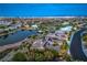 Desert home with lush landscaping, pond views, golf course proximity, and solar panels, combining luxury with sustainability at 5162 Estasi St, Las Vegas, NV 89135