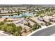 Desert home offering a well-manicured front yard, solar panels, desert landscaping, and pond access at 5162 Estasi St, Las Vegas, NV 89135