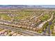Expansive aerial view of the neighborhood with golf course and mountain backdrop at 5162 Estasi St, Las Vegas, NV 89135