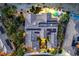 Desert home boasts a backyard oasis with a freeform pool, spa, lush landscaping, and outdoor lighting at 5162 Estasi St, Las Vegas, NV 89135