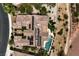 Aerial view of a private home featuring a pool, patio, desert landscaping and solar panels at 5162 Estasi St, Las Vegas, NV 89135