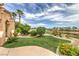 Well-maintained backyard with lush green grass, landscaping, and a view at 5162 Estasi St, Las Vegas, NV 89135