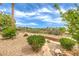 Well-maintained backyard with gravel landscaping, and a view of the golf course at 5162 Estasi St, Las Vegas, NV 89135