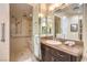 Bathroom showcasing a walk-in shower with bench, grab bars and dual shower heads at 5162 Estasi St, Las Vegas, NV 89135