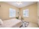 Cozy bedroom features neutral decor, tile floor, ceiling fan, and plantation shutters at 5162 Estasi St, Las Vegas, NV 89135