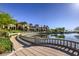 Luxury clubhouse with manicured landscaping and a tranquil lake, showcasing an elegant community setting at 5162 Estasi St, Las Vegas, NV 89135