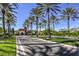 Beautiful community entrance adorned with palm trees and meticulous landscaping at 5162 Estasi St, Las Vegas, NV 89135