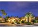 Nighttime exterior shot of home with lighted landscaping and a three-car garage at 5162 Estasi St, Las Vegas, NV 89135