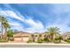 Charming home featuring manicured desert landscaping, a wrought iron gate and three car garage at 5162 Estasi St, Las Vegas, NV 89135