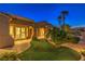 Charming home exterior with landscaped yard, artificial grass, and inviting architecture at 5162 Estasi St, Las Vegas, NV 89135