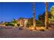 Exterior featuring rock landscaping, mature palm trees and a desert vibe at 5162 Estasi St, Las Vegas, NV 89135