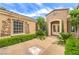 Beautiful home exterior featuring well-maintained landscaping, a welcoming entrance, and a unique window design at 5162 Estasi St, Las Vegas, NV 89135