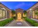 Charming entrance with manicured landscaping and decorative accents at twilight at 5162 Estasi St, Las Vegas, NV 89135