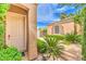 Charming front entrance with mature landscaping and walkway to the front door at 5162 Estasi St, Las Vegas, NV 89135