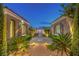 Front yard showcasing mature landscaping, pathway, gate, and detached three-car garage at 5162 Estasi St, Las Vegas, NV 89135