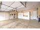 Spacious garage with epoxy floors, bright lighting, storage cabinets, and fire extinguisher at 5162 Estasi St, Las Vegas, NV 89135