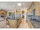 Spacious kitchen features a large island, stainless steel appliances, and granite countertops, open to the living space at 5162 Estasi St, Las Vegas, NV 89135
