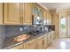Kitchen features granite countertops, stainless steel appliances, light-colored cabinets, and a tile backsplash at 5162 Estasi St, Las Vegas, NV 89135