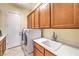 Functional laundry room with modern washer and dryer and plenty of cabinet space at 5162 Estasi St, Las Vegas, NV 89135