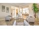 Inviting living room with comfortable seating, neutral decor, and views into the adjoining dining area at 5162 Estasi St, Las Vegas, NV 89135
