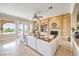 Bright living room with built-in shelving, a fireplace, and access to the outdoor space at 5162 Estasi St, Las Vegas, NV 89135