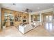 Spacious living room featuring custom built-ins, a fireplace, stylish furniture, and easy access to the outdoors at 5162 Estasi St, Las Vegas, NV 89135