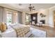 Spacious main bedroom with natural light, elegant furnishings, and hardwood floors at 5162 Estasi St, Las Vegas, NV 89135