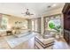 Spacious main bedroom with natural light, elegant furnishings, and hardwood floors at 5162 Estasi St, Las Vegas, NV 89135
