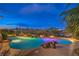 Tranquil pool area at night featuring ambient lighting and scenic views at 5162 Estasi St, Las Vegas, NV 89135